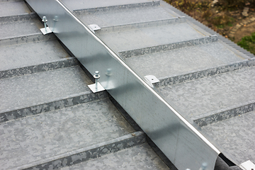 Image showing The barrier for snow retention on thel roof