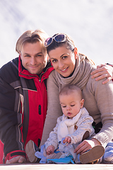 Image showing young happy family with little child enjoying winter day