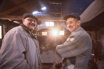 Image showing portrait of two confident senior blacksmith