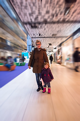 Image showing young mother and her little pretty daughter shopping together