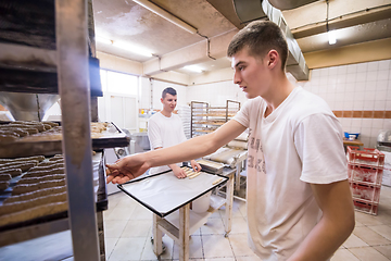 Image showing bakers preparing the dough