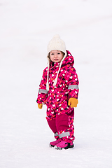 Image showing little girl having fun at snowy winter day