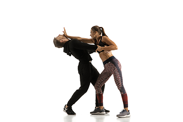 Image showing Man and woman fighting in studio, women\'s self-defense concept