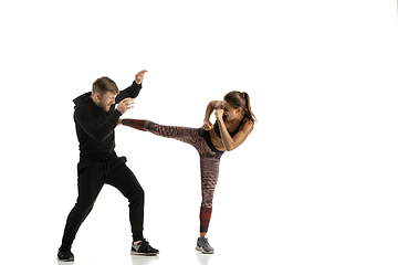 Image showing Man and woman fighting in studio, women\'s self-defense concept