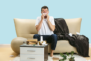 Image showing Young man suffering from hausehold dust or seasonal allergy.