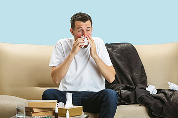 Image showing Young man suffering from hausehold dust or seasonal allergy.