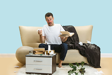 Image showing Young man suffering from hausehold dust or seasonal allergy.