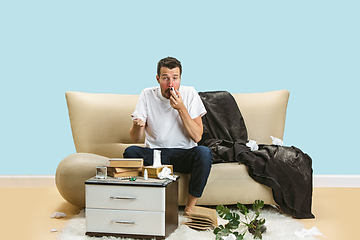 Image showing Young man suffering from hausehold dust or seasonal allergy