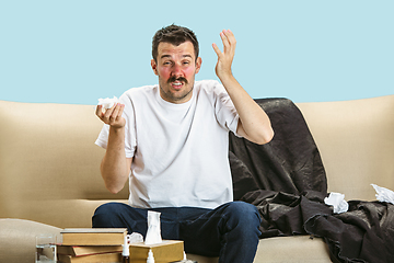 Image showing Young man suffering from hausehold dust or seasonal allergy.