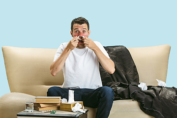 Image showing Young man suffering from hausehold dust or seasonal allergy