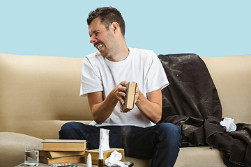 Image showing Young man suffering from hausehold dust or seasonal allergy.