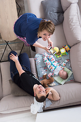 Image showing top view of happy mother and father taking picture of baby