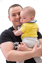 Image showing portrait of happy young father holding baby isolated on white