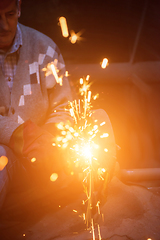 Image showing the blacksmith polishing metal products