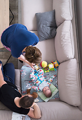 Image showing top view of happy mother and father taking picture of baby