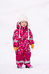 Image showing little girl having fun at snowy winter day