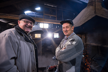 Image showing portrait of two confident senior blacksmith