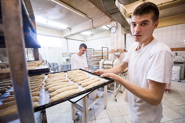 Image showing bakers preparing the dough