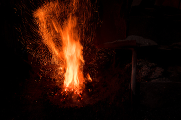 Image showing Traditional blacksmith furnace with burning fire