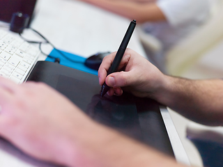 Image showing Closeup of Graphic Designer Working at Workplace