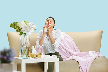 Image showing Young woman suffering from hausehold dust or seasonal allergy.