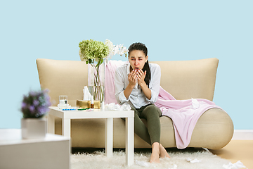 Image showing Young woman suffering from hausehold dust or seasonal allergy.