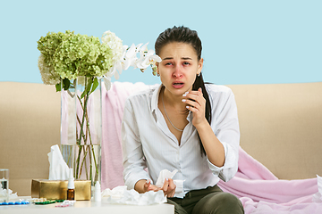 Image showing Young woman suffering from hausehold dust or seasonal allergy.