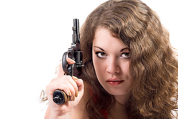 Image showing Young woman with a pistol. Isolated on white