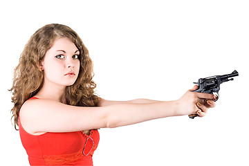 Image showing Young woman with a revolver. Isolated on white