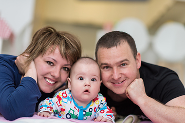 Image showing Portrait of young happy couple with their adorable baby boy