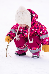 Image showing little girl having fun at snowy winter day