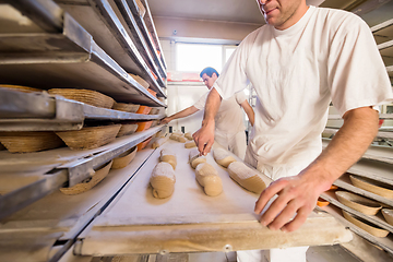 Image showing bakers preparing the dough