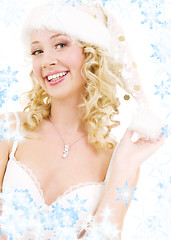 Image showing cheerful santa helper girl