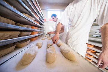 Image showing bakers preparing the dough