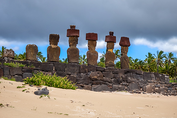 Image showing Anakena palm beach and Moais statues site ahu Nao Nao, easter is