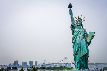 Image showing Statue of liberty and tokyo cityscape, Japan