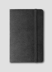 Image showing black closed notebook isolated on grey