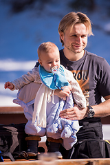 Image showing young happy family with little child enjoying winter day