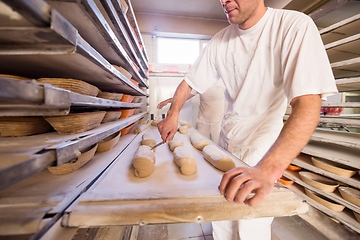 Image showing bakers preparing the dough