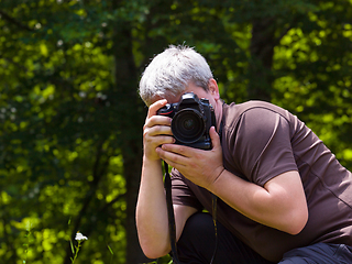 Image showing male photographer photographing nature