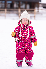 Image showing little girl having fun at snowy winter day