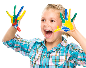 Image showing Portrait of a cute girl playing with paints