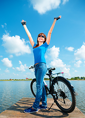 Image showing Young woman raised her hands up in joy