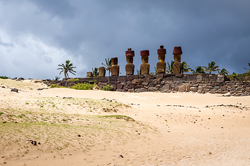 Image showing Anakena palm beach and Moais statues site ahu Nao Nao, easter is