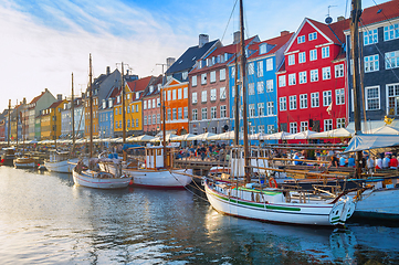 Image showing Sunset Nyhavn embankment with boats 