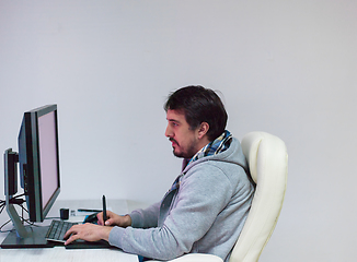 Image showing Graphic Designer Working at Workplace