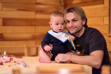 Image showing Portrait of young father and his cute baby son