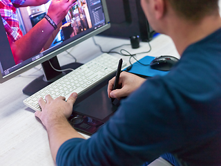 Image showing Closeup of Graphic Designer Working at Workplace