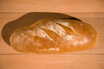 Image showing fresh bread on wooden table