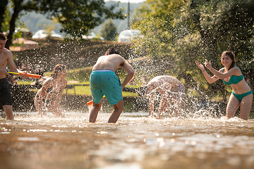 Image showing summer joy friends having fun on river